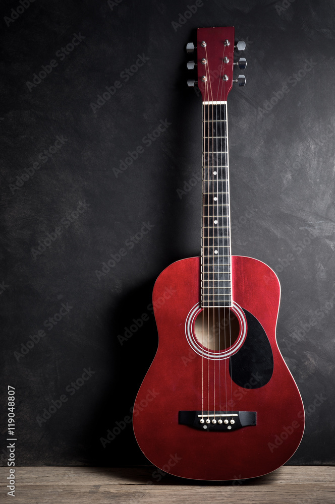 Still life photography : old acoustic guitar on old wood with art dark background