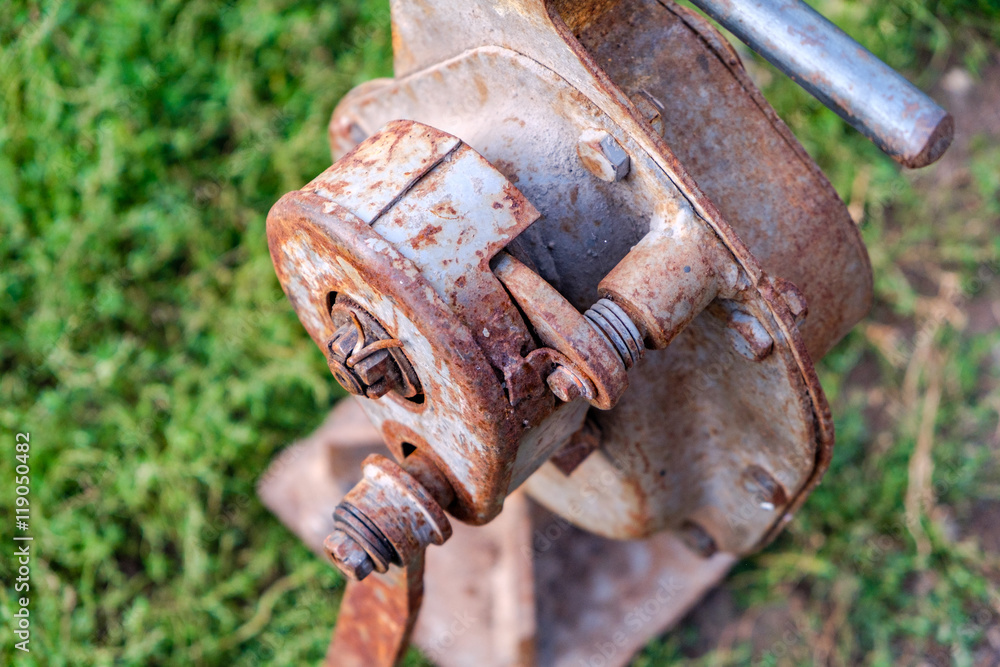 House lifting jack. Old rusty mechanical screw jack. Close-up House lifting jack. Old rusty mechanical screw jack. Close-up