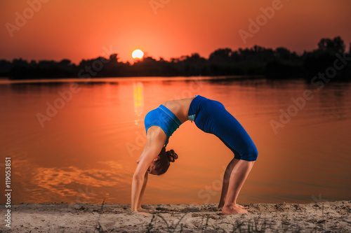 yoga at sunset on the beach.