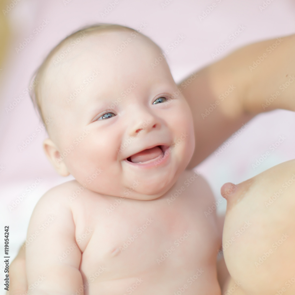 Baby smiling in time of breastfeeding