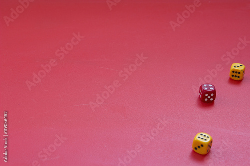 Three dices for the game on a red matte table. Chance or Lucky case concept. Selective focus.