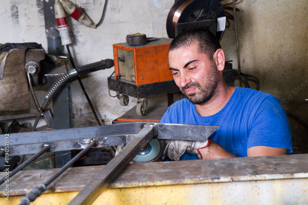 metalworker at work in his workshop metalworker at work in his workshop