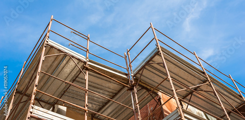 House for renovation with the scaffolding for bricklayers