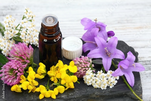 Fototapeta Naklejka Na Ścianę i Meble -  Essential oil & meadow flowers