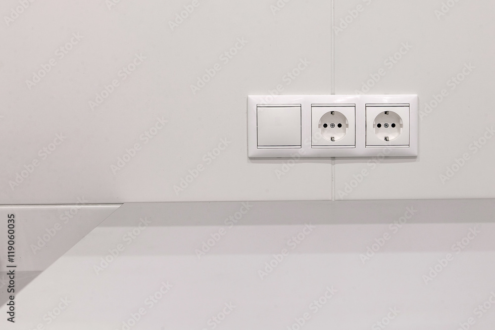 electrical outlets and switch on the wall Stock Photo | Adobe Stock