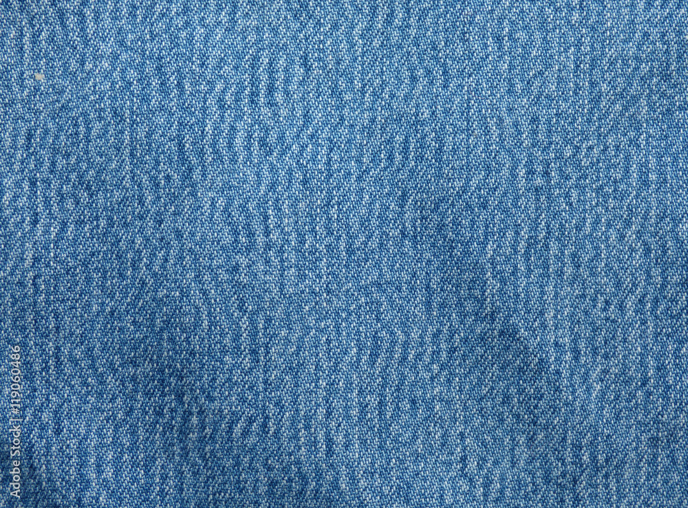 Blue smooth jeans texture. Fabric background. Blue smooth jeans texture. Fabric background.