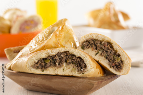 Brazilian snack. Meat Esfiha on the table photo