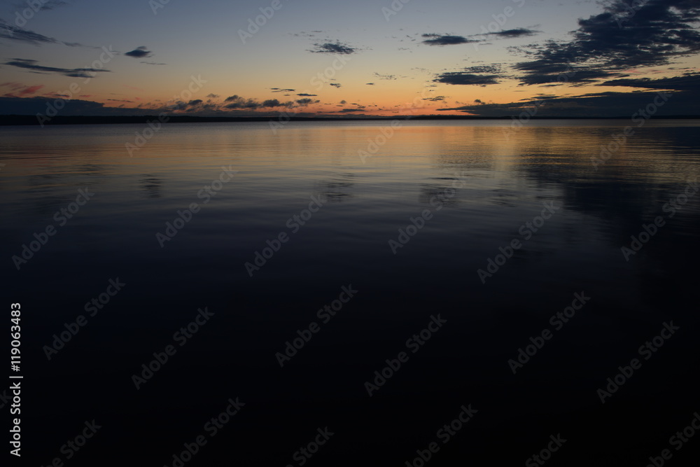 The onset of night water lake retains sunset shadows