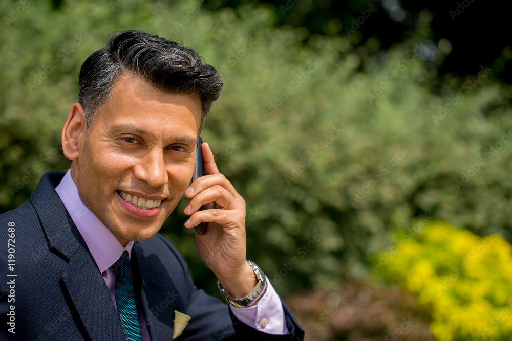 Businessman Using a cell phone. Businessman Using a cell phone.