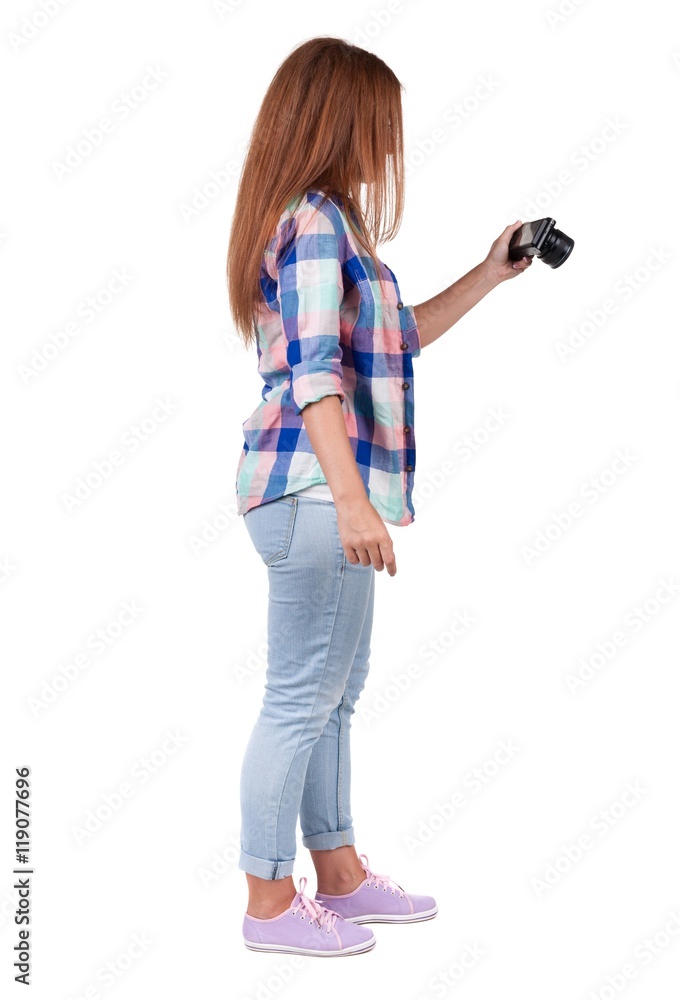 Back view of woman photographing. girl photographer in jeans. Rear view people collection. backside view of person. Isolated over white background. Back view of woman photographing. girl photographer in jeans. Rear view people collection. backside view of person. Isolated over white background.