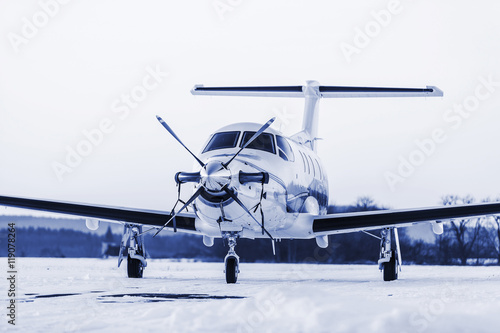 Fototapeta Naklejka Na Ścianę i Meble -  Single turboprop aircraft on winter runway. Pribram airport.