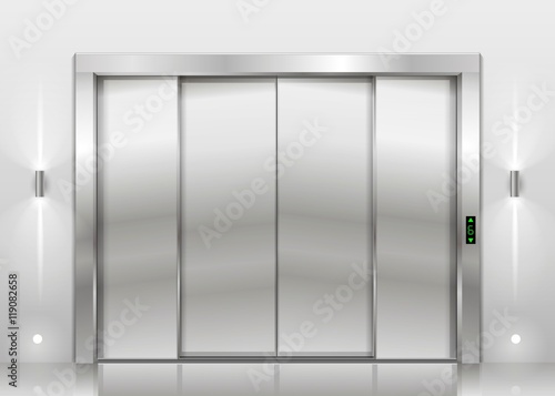 Closed door of the freight elevator hospital or office building. Metal armored sliding door.
