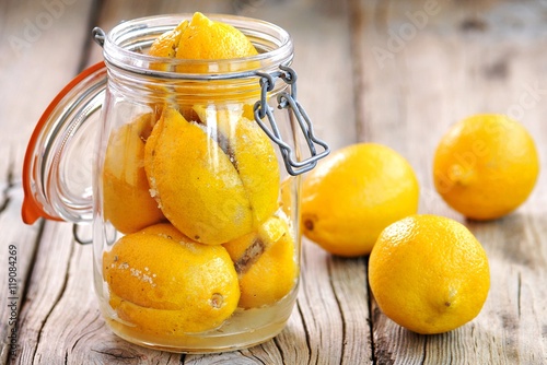 Preserved lemons with sea salt and spices. Moroccan cuisine. Vintage style.