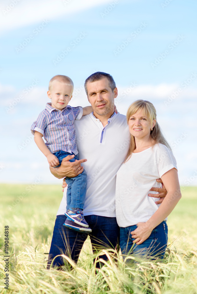 the happy family walks across the field the happy family walks across the field