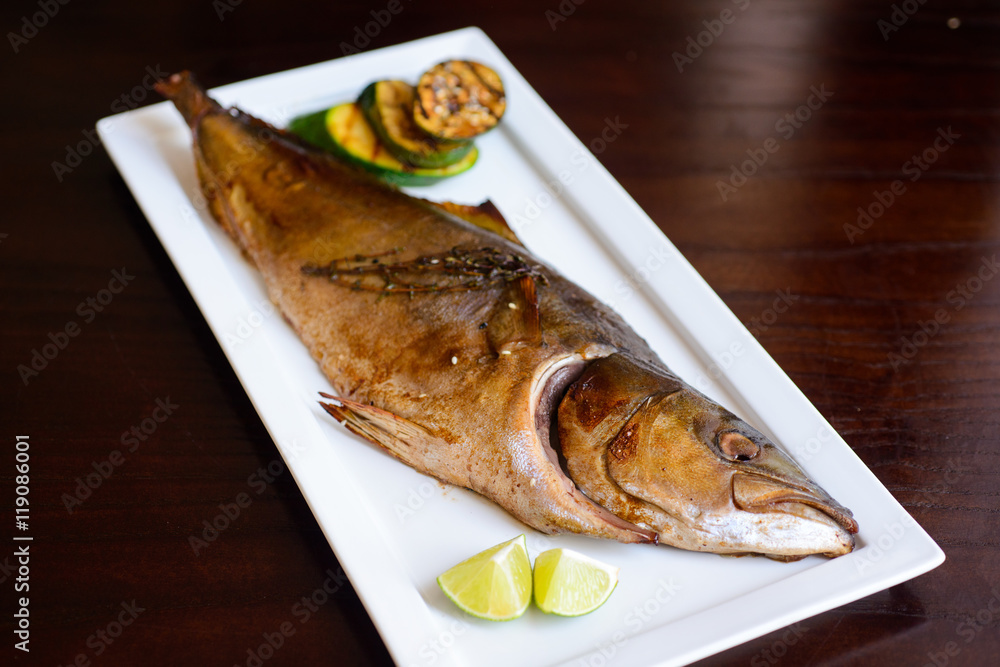 grilled tuna on a white plate served. grilled tuna on a white plate served.