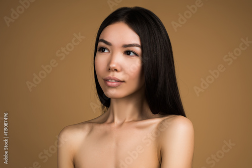 Beautiful Woman With Perfect Skin and Long Hair Beauty Studio Portrait