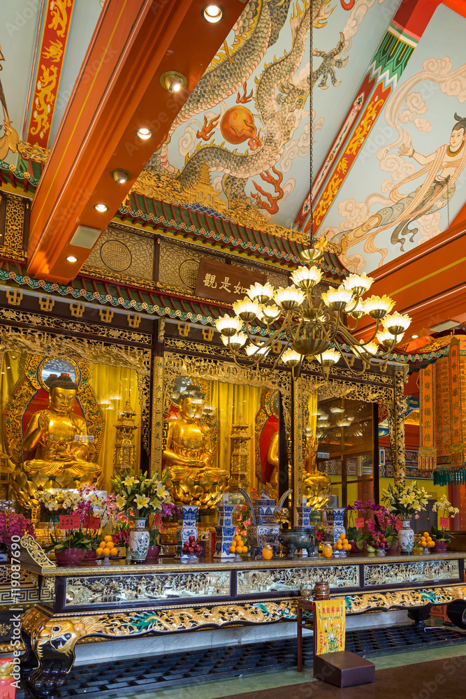 Fototapeta premium Buddha statues and altar at the Main Shrine Hall of Buddha at the Po Lin Monastery on Lantau Island in Hong Kong, China.
