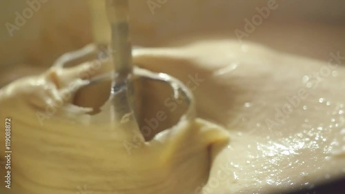 Close-up of slow motion mixing muffin mixture with electric mixer FullHD 1080p
