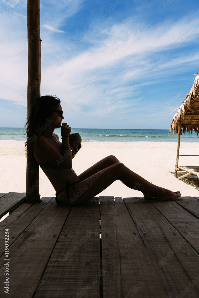 Woman Relaxing On The Beach.