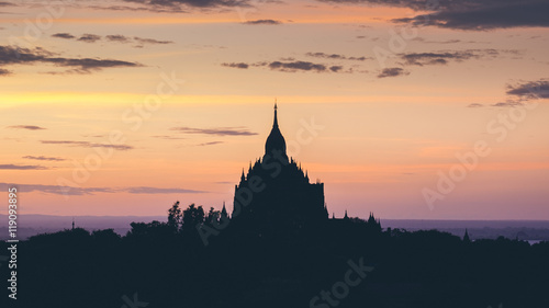 Ancient temples silhouette at colorful golden sunset  Bagan  Mya