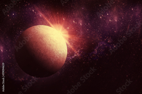 planet with sunrise on the background of stars