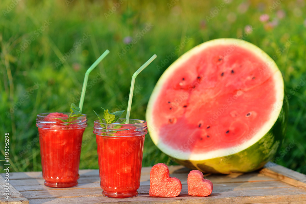 Watermelon red smoothie as healthy summer drink. Bio organic and vegan beverage with hearts. Watermelon red smoothie as healthy summer drink. Bio organic and vegan beverage with hearts.