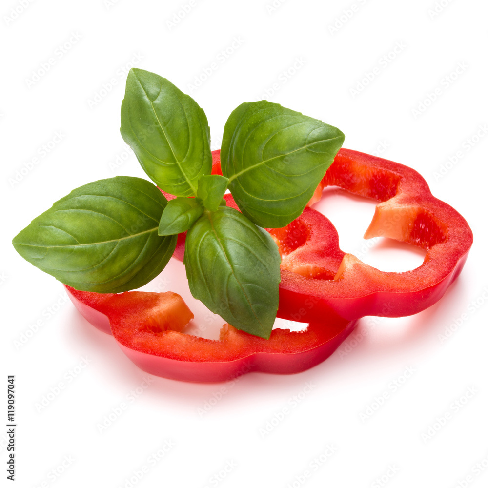 Red sweet bell pepper slices and basil leaves isolated on white Red sweet bell pepper slices and basil leaves isolated on white
