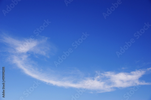 white cloud in winding shape on the blue sky