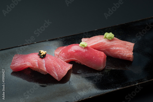 three styles fatty tuna sushi, akami, chuoro, otoro, with golden