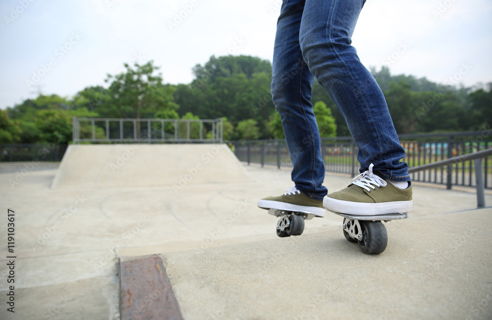 freeline skateboarder legs riding on freeline at skatepark freeline skateboarder legs riding on freeline at skatepark