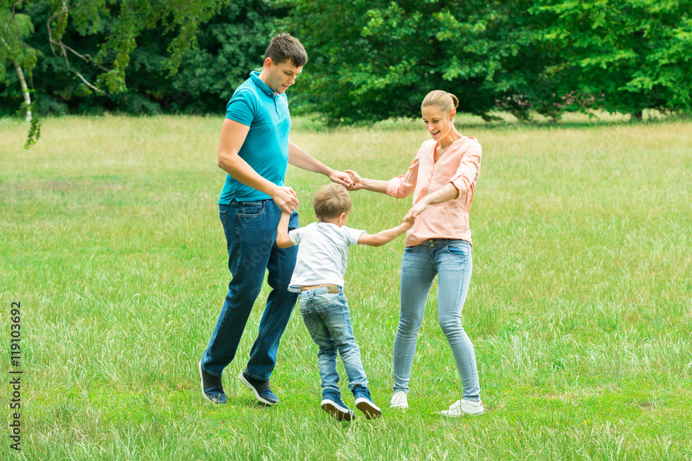 Happy Young Family Holding Hands Happy Young Family Holding Hands
