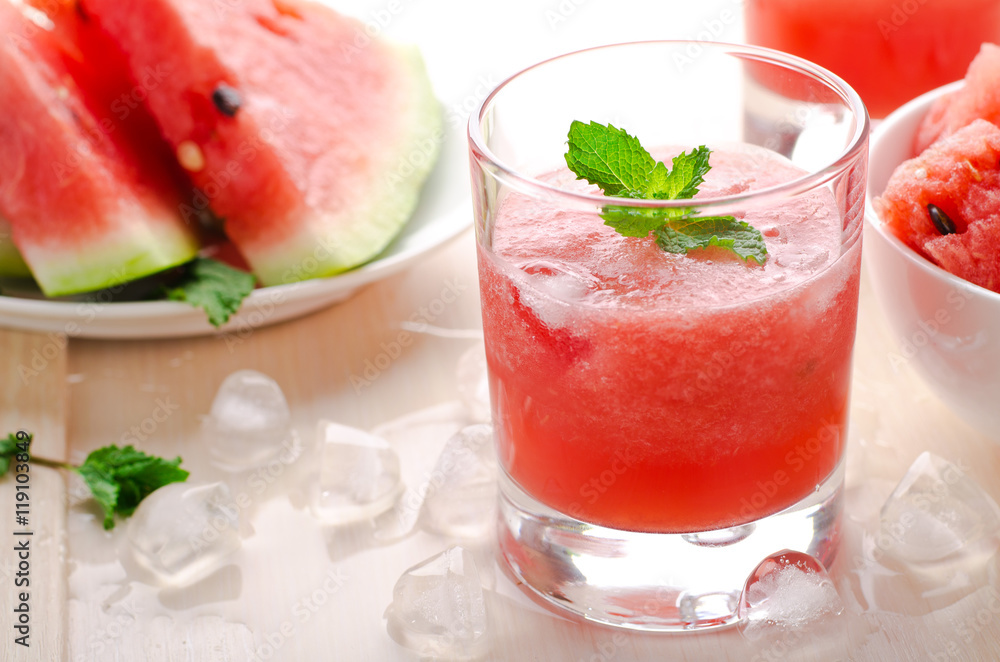 Healthy watermelon smoothie with mint and ice in glass Healthy watermelon smoothie with mint and ice in glass