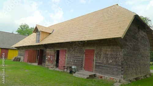 Wallpaper Mural A big cabin house with red doors it has four doors and a big shingle roof Torontodigital.ca