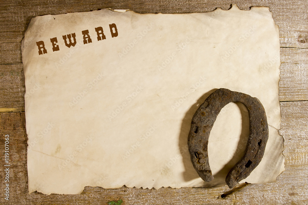 Old horseshoe and the announcement of the award - obrazy, fototapety, plakaty 