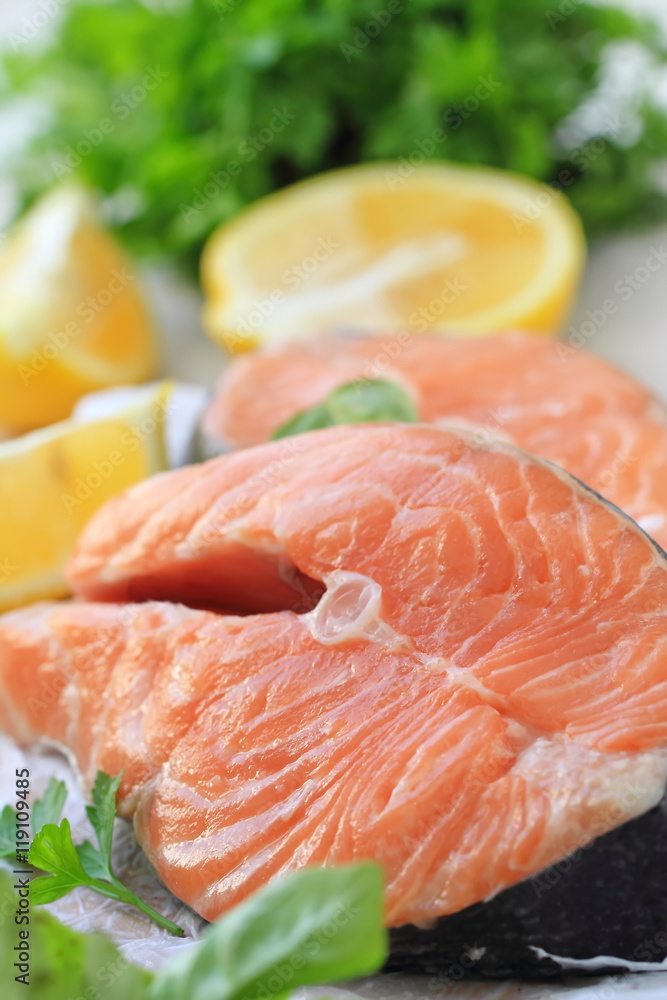 Raw fish with vegetables and lemon prepared for cooking Raw fish with vegetables and lemon prepared for cooking
