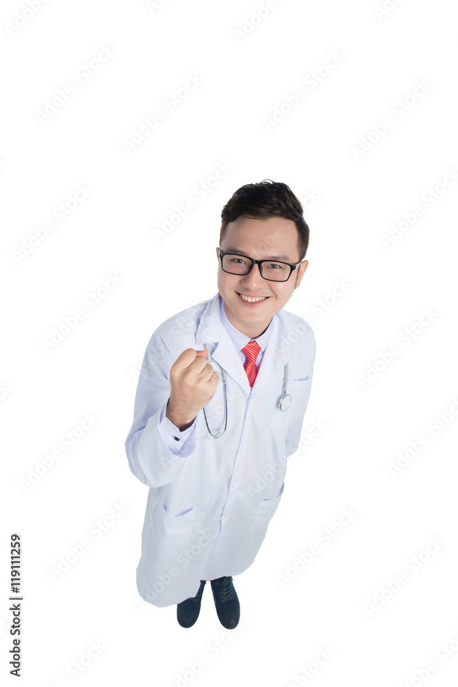 Top view of a smiling young medical doctor isolated over white b Top view of a smiling young medical doctor isolated over white b