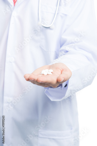 Male asian doctor showing pills