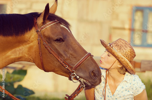 woman kissing horse © PaulShlykov