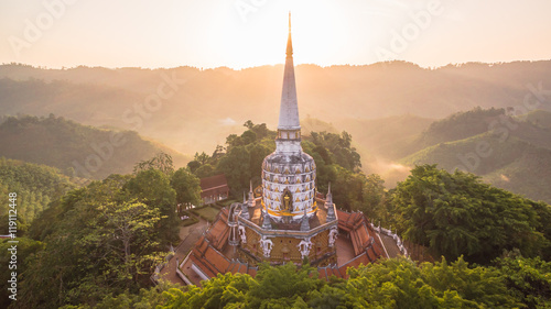 a style of Buddha with a naga over the head at wat Bangreang in PhangNga province.when  aerial photo by drone you can see Buddha statue QuanYin and big pagoda on the hill top 