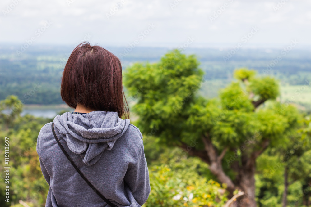 Freedom traveler woman standing enjoying a beautiful nature. Freedom traveler woman standing enjoying a beautiful nature.