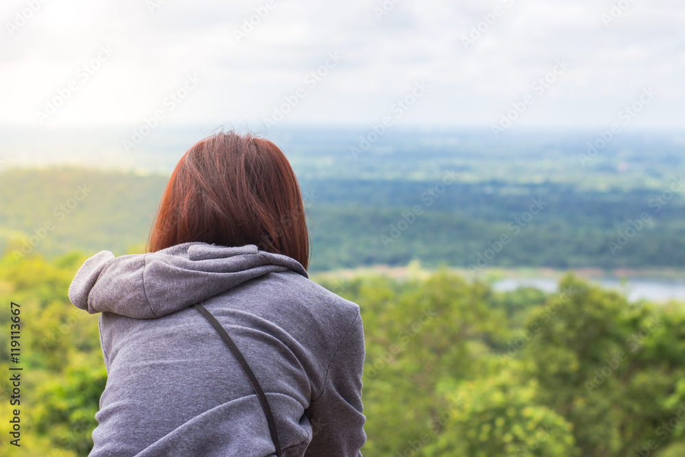 Freedom traveler woman standing enjoying a beautiful nature.