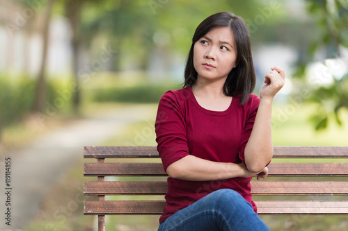 Angry Woman Sitting on Bench at Park