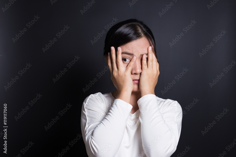 Woman hiding face laughing timid Woman hiding face laughing timid