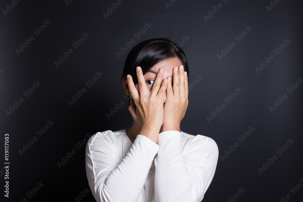Woman hiding face laughing timid Woman hiding face laughing timid