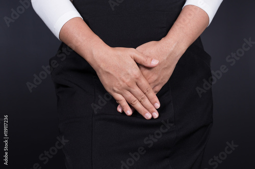 Woman with Hands Holding her Crotch