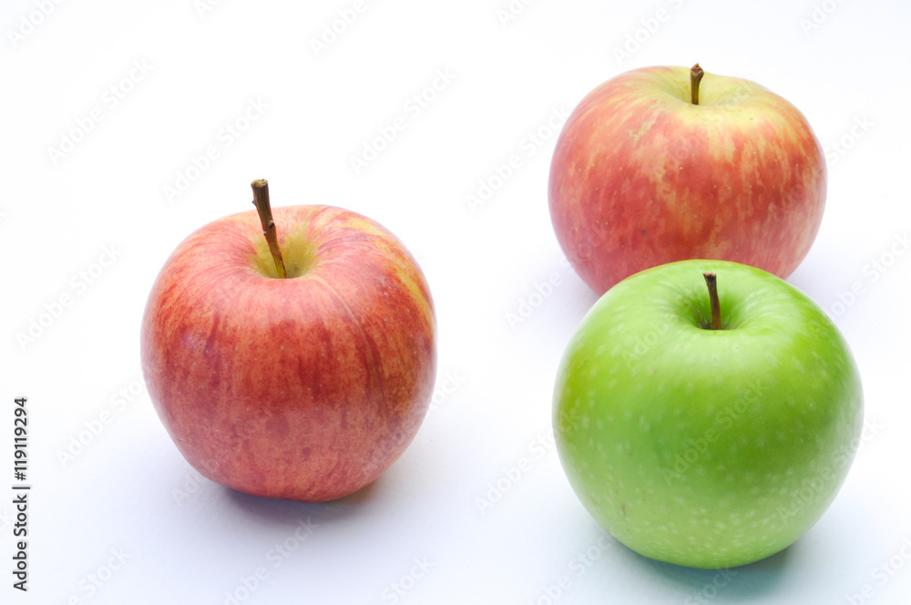 different concepts - green apple between red apples different concepts - green apple between red apples