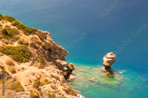 Beautiful reef at lake Perachora in Greece with green crystal water. Long exposure technique. 