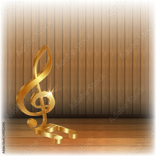Golden treble clef on wooden background