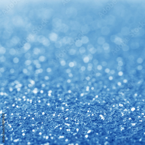 Blue defocused glitter background.