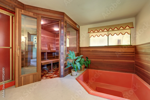 Interior of home wooden sauna cabin with jacuzzi bath © Iriana Shiyan